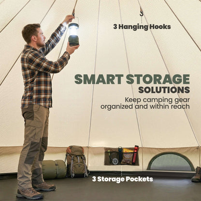A man using a lantern in a camping tent with hooks and storage pockets, showcasing smart storage solutions.