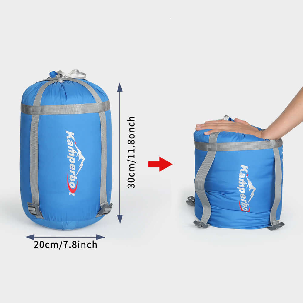 Compact and lightweight 3 Season Sleeping Bag in a blue stuff sack, ideal for outdoor adventures.